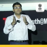 IAS officer Himanshu Gupta speaking on stage